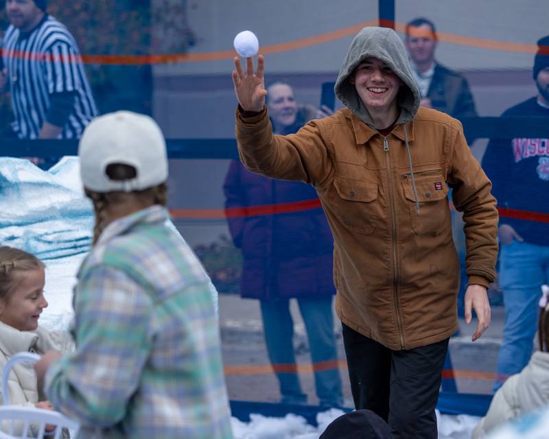 Kid throws "snowball" at the annual 'Ax Church Ultimate Snowball Fight' at Frosty on First on Saturday, November 8, 2025 on First Street in La Salle.