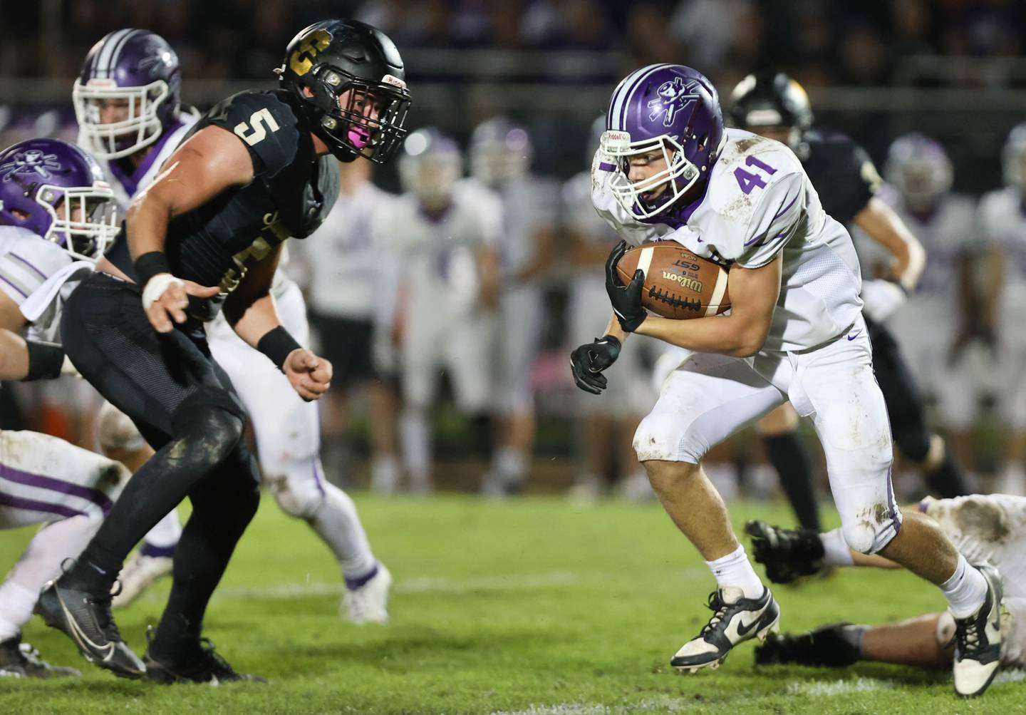 Rochelle's Dylan Manning tries to get by Sycamore's Kyle Prebil during their game Friday, Sept. 22, 2023, at Sycamore High School.