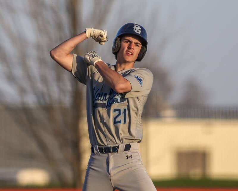 Plainfield South's Nicholas Ruenzi (21) flexes after hitting a double during baseball game between Plainfield South at Oswego on Monday, April 14, 2025 in Oswego.