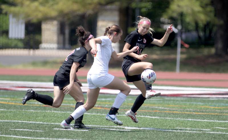 (From right) Benet’s Bailey Abbott, Crystal Lake Central’s Jillan Mueller and Benet’s Gabby Hedden go after the ball during a Class 2A girls state soccer semifinal at North Central College in Naperville on Friday, June 2, 2023.