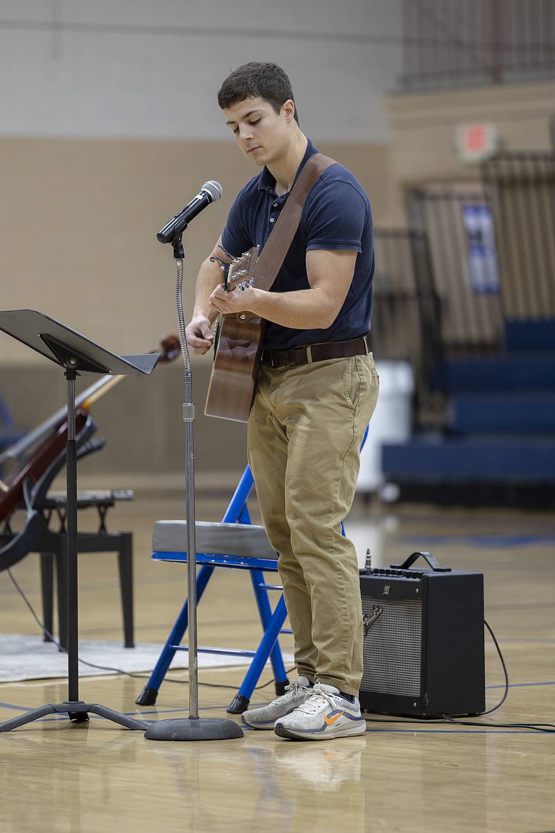 Ryan Partington plays the Morgan Wallen song “The Way I Talk” Thursday, Jan. 30, 2025, during Newman’s talent show. NHS held the show in celebration of Catholic Schools Week.