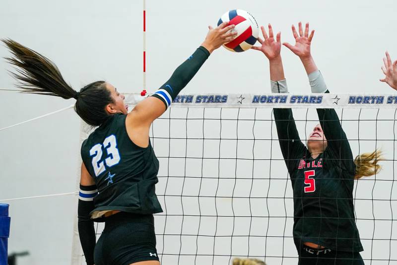 St. Charles North's Haley Burgdorf (23) plays the ball at the net against Huntley’s Emily Ernst (5) during a  non-conference match at St. Charles North High School on Wednesday, Sept. 3, 2025.