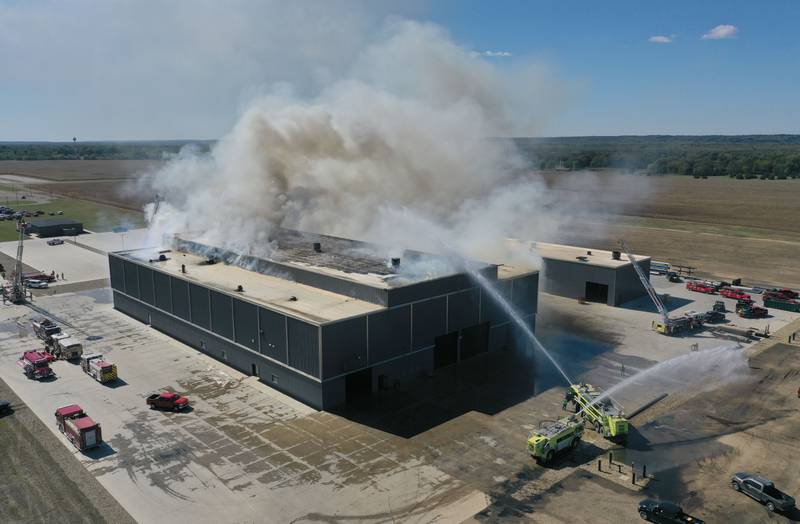 Smoke billows from Marquis Energy as firefighters work to control a structure fire on Wednesday, Oct. 8, 2025 in Hennepin. The fire was upgraded to a 5th alarm dispatching the (MABAS) Mutual Aid Box Alarm System. The fire broke out around 11a.m.