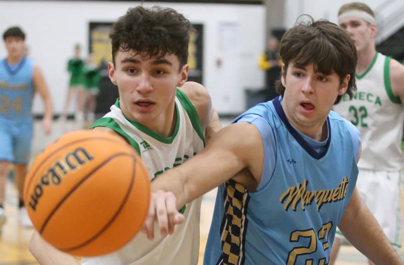 Seneca's Brayden Simek and Marquette's Jaxon Rix watch the ball sail out of bounce during the Tri-County Conference championship on Friday, Jan. 31, 2025 at Putnam County High School.