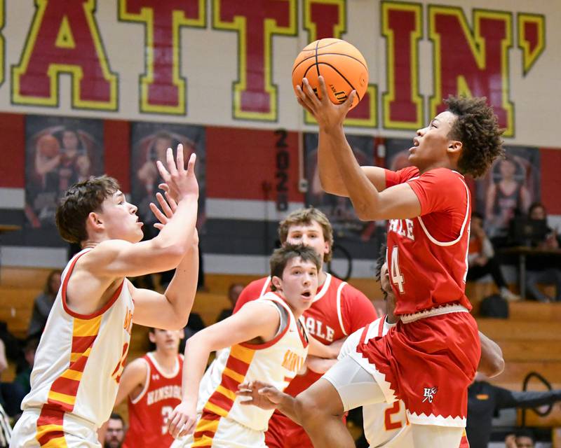 Hinsdale Central's Dominic Walker (14) goes up for a shot while being defended by Batavia's Dane Farrar (15) during the game on Saturday Jan. 24, 2026, held at Batavia High School.