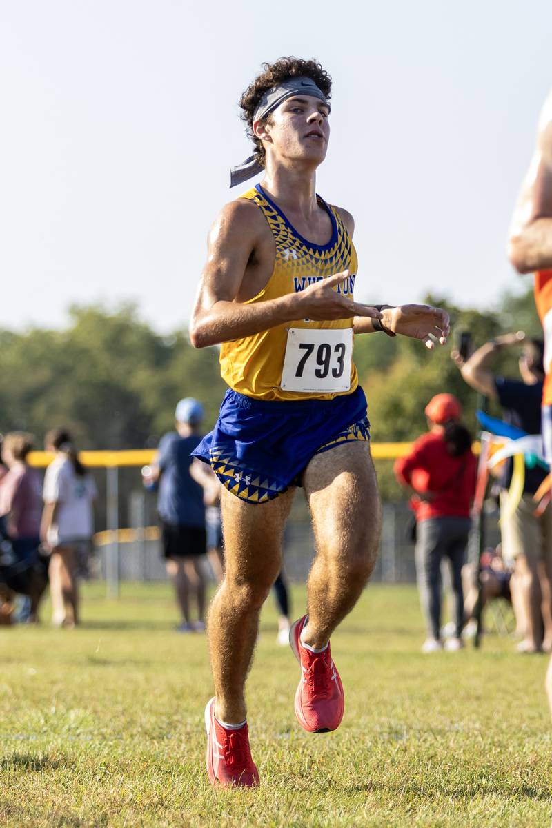 Wheaton’s Jack Sanders crosses the finish line at the Locktoberfest three-mile varsity cross country race at Dellwood Park in Lockport on October. 4, 2025.