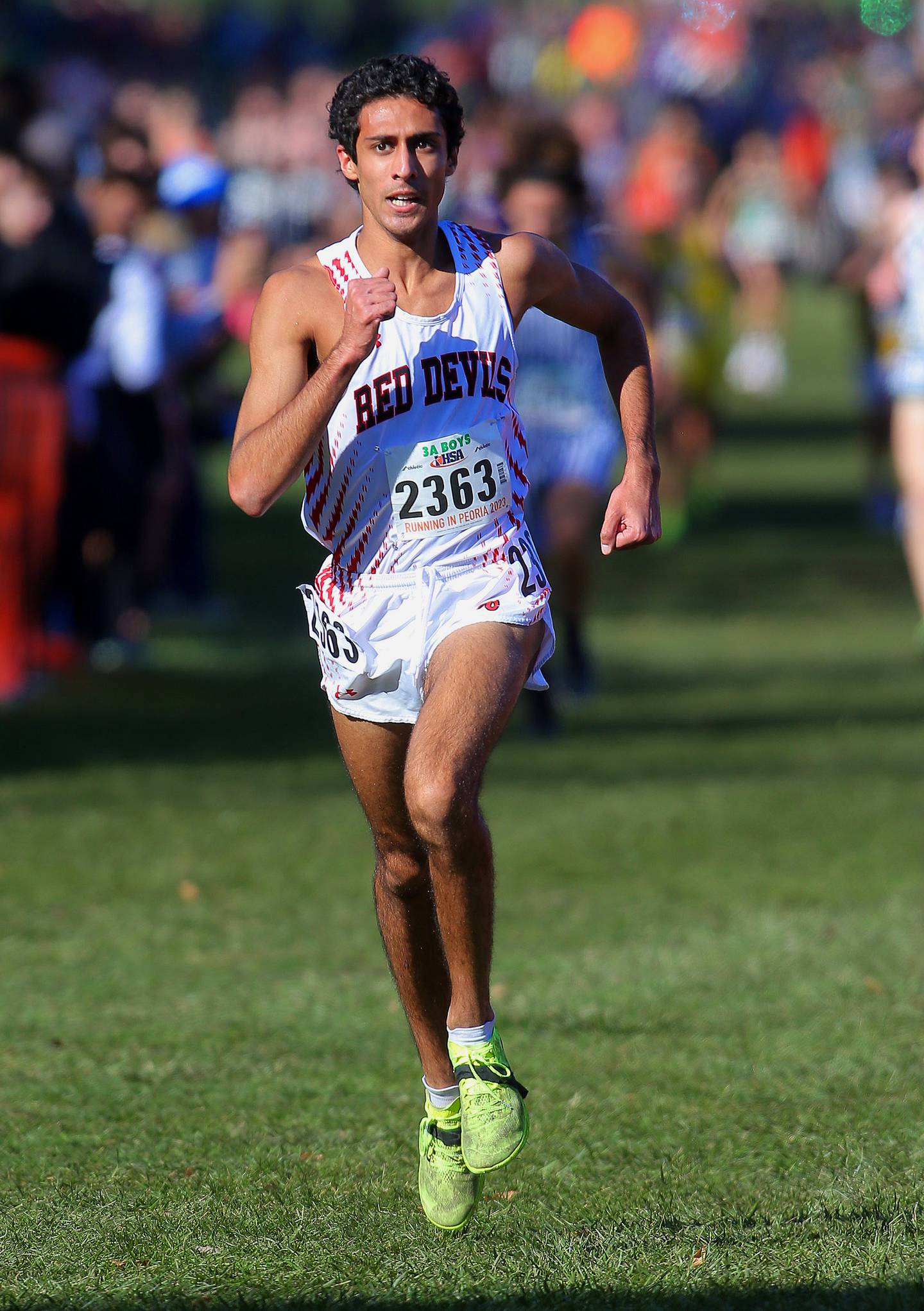 November 4, 2023 - Peoria, Illinois - Hinsdale Central's Aden Bandukwala runs to the finish line  during the Class 3A race at the IHSA State Cross Country State Finals on Saturday.  (Photo: PhotoNews Media/Clark Brooks)