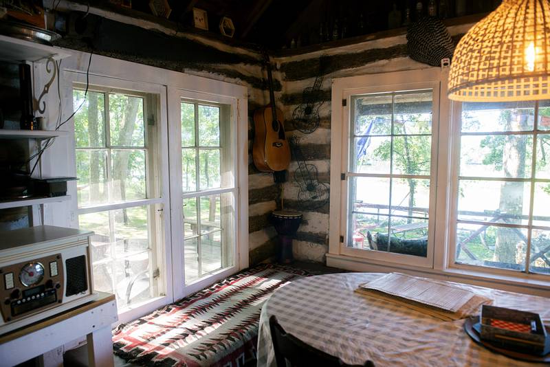 Lots of natural light and a view of the Rock River make the dining area of Tim Benedict's cabin exceptionally cozy.