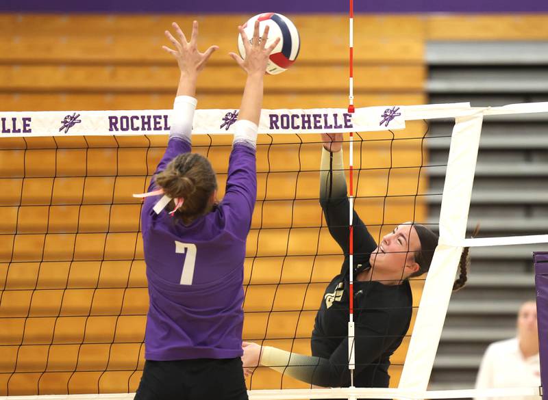 Sycamore's Sophia Lichthardt tries to get the ball by Rochelle's Meredith Bruns Tuesday, Oct. 28, 2025, during their Class 3A regional semifinal match at Rochelle High School.