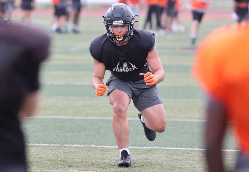 DeKalb linebacker Daniel Roman-Johnson walks through some plays during practice Wednesday, July 12, 2023, at the school.