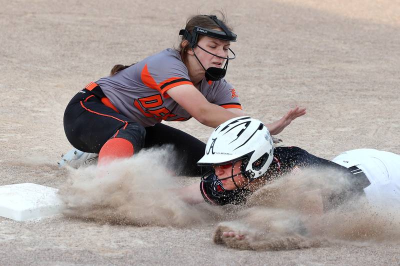 Dekalb's Hazel Montavon tags an Auburn baserunner diving back into third but is called for obstruction on the play during their Class 4A regional game Wednesday, May 24, 2023, at DeKalb High School.