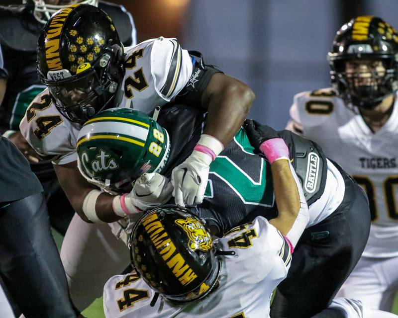 Plainfield Central's Malik Jassim (22) is brought down by Joliet West's Jakobe Rogers (24) during football game between Joliet West at Plainfield Central.   Oct 20, 2023.