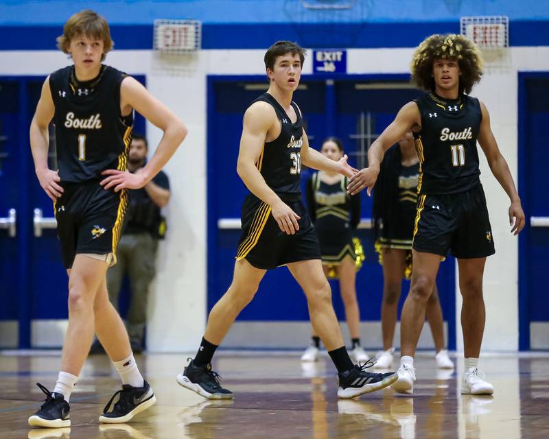 Hinsdale South's Brendan Savage (30) checks into the game halfway through the first quarter during basketball game between Hinsdale South at Downers Grove South. Dec 1, 2023.