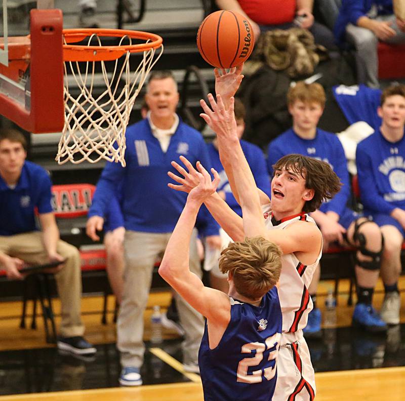 Hall's Braden Curran shoots a shot over Newman's Lucas Simpson on Friday, Feb. 3, 2023 at Hall High School.