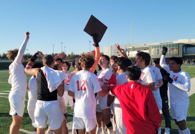 The Ottawa boys soccer team celebrates with their Class 2A regional plaque after defeating host Galesburg 3-2 on Saturday afternoon.