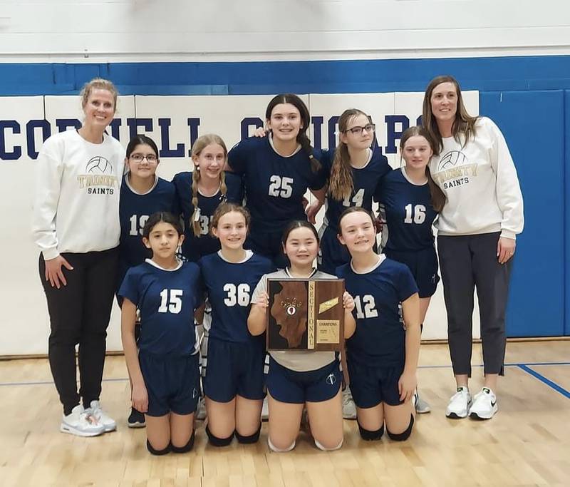 The Trinity Catholic seventh grade volleyball team advanced to the IESA Class 1A state tournament with a win over Marquette in the sectional final. Pictured, front row: Alexis Robles, Lily Tielebein, Mary Simonetta and Allie Inman. Back row: Coach Laura Urbanski, Sofia Sarabia, Aubrey Urbanski, Hanna Washkowiak, Hailey O’Hare, Payden Kelly and Tara Duncan.