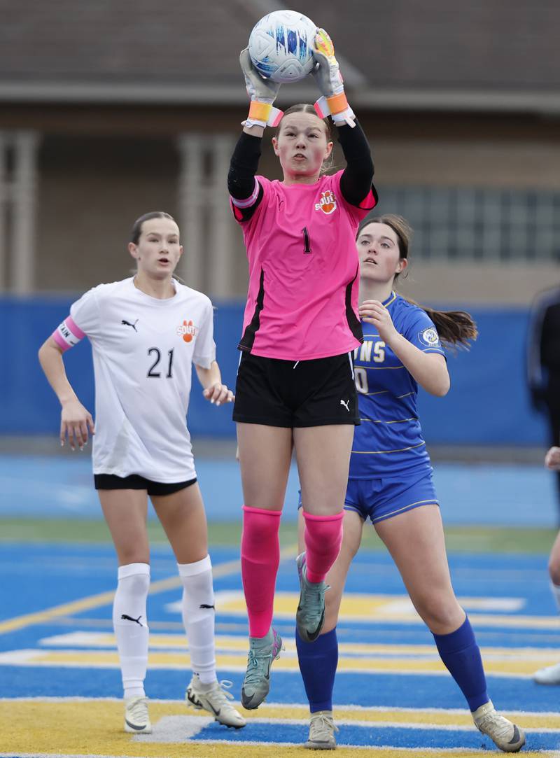 Wheaton Warrenville South's Marilyn Dixon (1) makes a save during the girl's varsity soccer match between Lyons Township and Wheaton Warrenville South high schools on Thursday, March 27, 2025 in Western Springs.