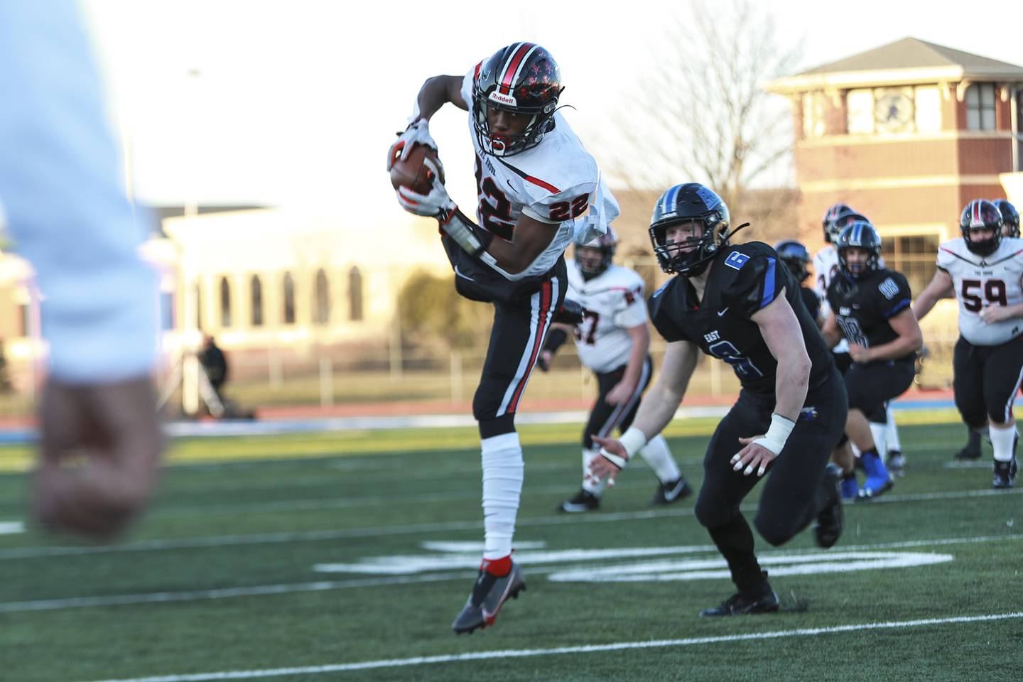 Bolingbrook's Kyan Berry-Johnson makes a catch on Friday, March 19, 2021, at Lincoln-Way East High School in Frankfort, Ill. The Griffins defeated the Raiders 42-14.