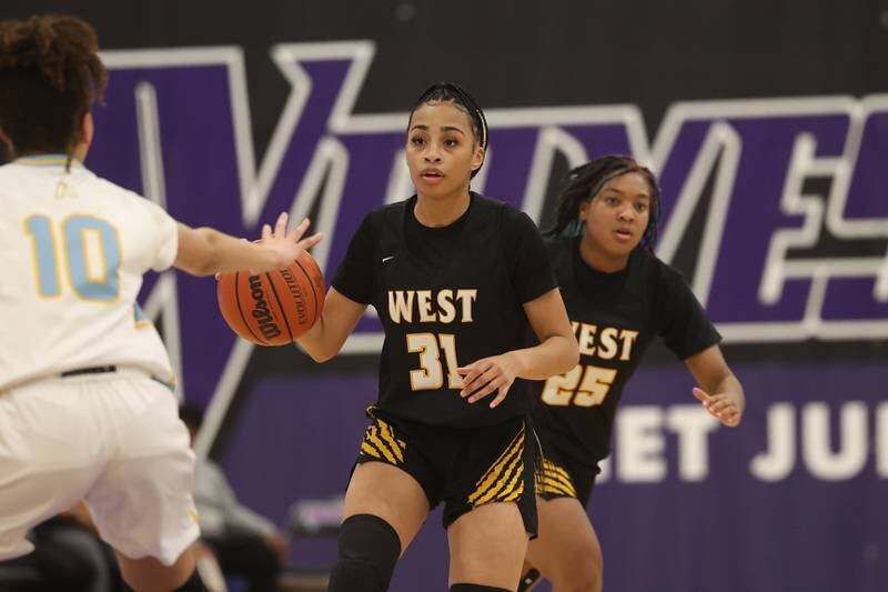 Joliet West’s Alaya Redditt takes the ball upcourt against Joliet Catholic in the 2023 WJOL Girls Basketball Tournament on Friday, Nov. 17, 2023, in Joliet