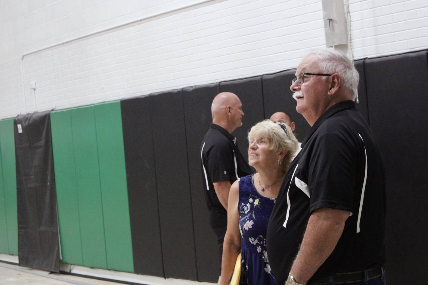 Rock Falls High School board member Jan McKanna talks to board President Merle Gaulrapp about the improvements made to Tabor Gymnsium during a tour of ongoing renovation on Wednesday.
