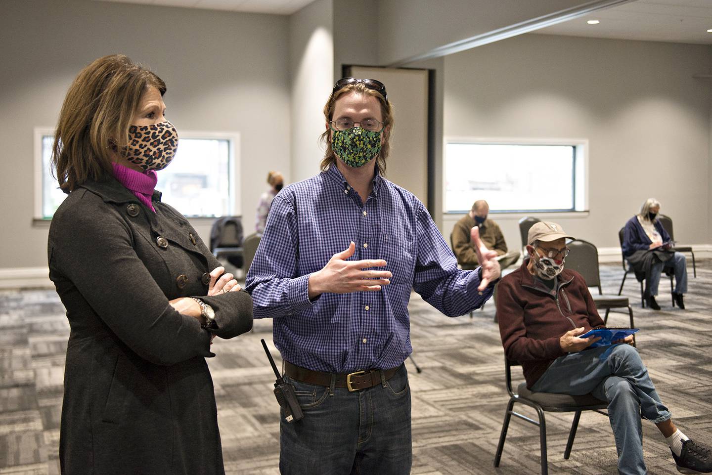 Congresswoman Cheri Bustos speaks with Cory Law of the Whiteside County Health Department while touring a vaccination site in Rock Falls Thursday morning.