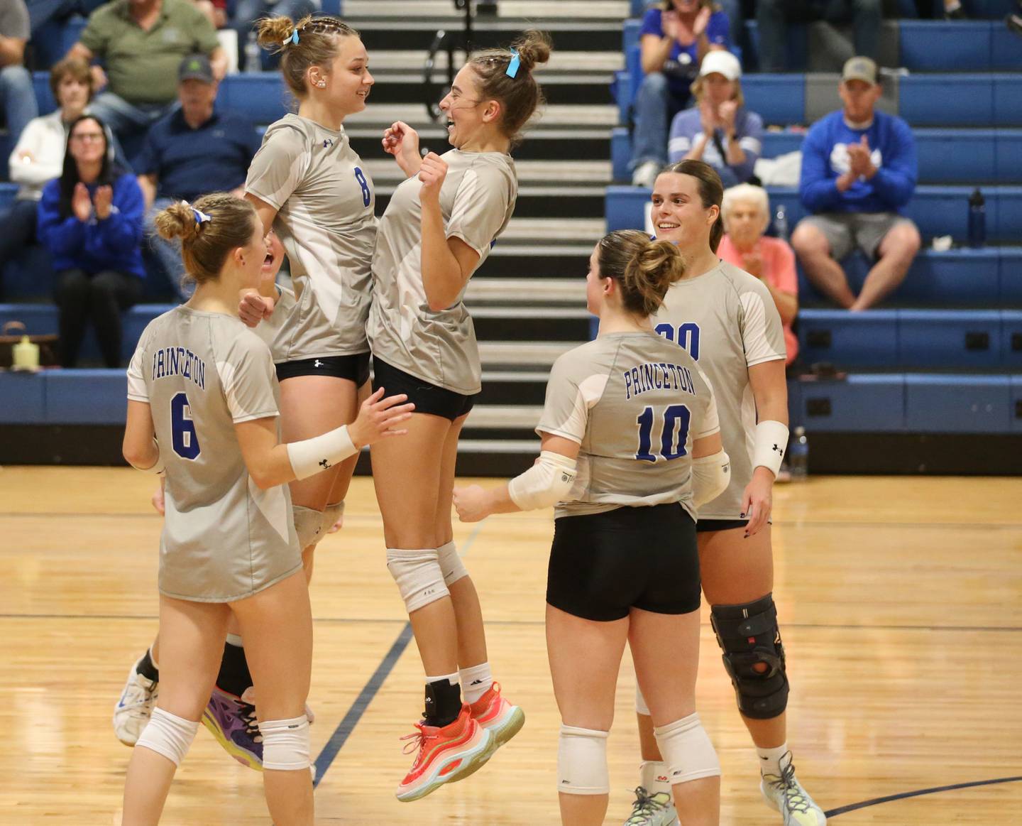 Princeton's Keighley Davis chest bumps teammate Kathy Maciczak after scoring a point against El Paso-Gridley in the Class 2A Regional Semifinals on Tuesday, Oct. 29, 2024 at Fieldcrest High School.