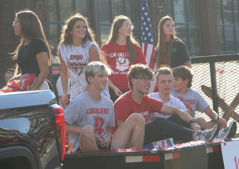 Members of the L-P cross country team ride a float during the L-P homecoming parade on Thursday, Oct. 2, 2025 downtown Peru.