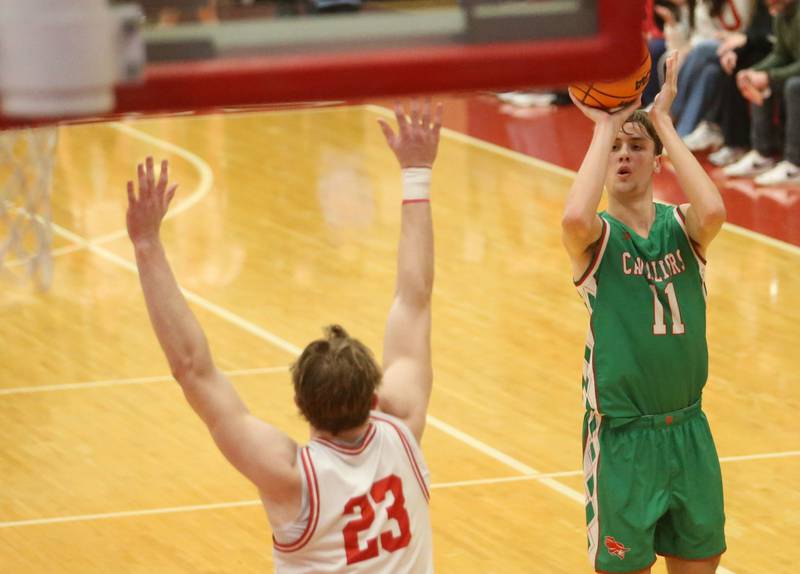 L-P's Jameson Hill shoots a jump shot over Ottawa's Owen Sanders on Friday, Feb. 6, 2026 in Kingman Gymnasium at Ottawa High School.