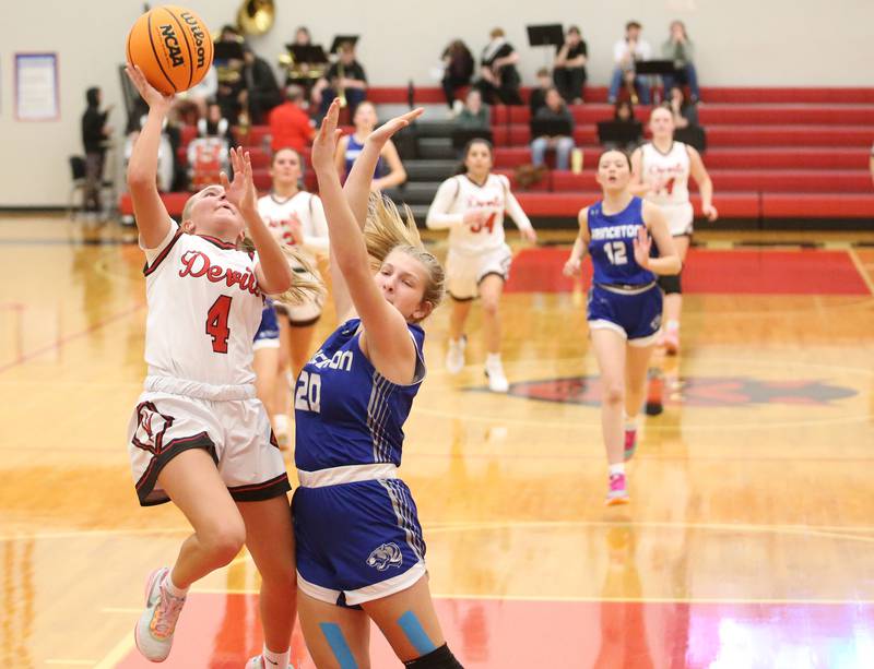 Hall's Charlie Pellegrini eyes the hoop as she gets fouled by Princeton's Reese Reviglio on Monday, Jan. 6, 2025 at Hall High School.
