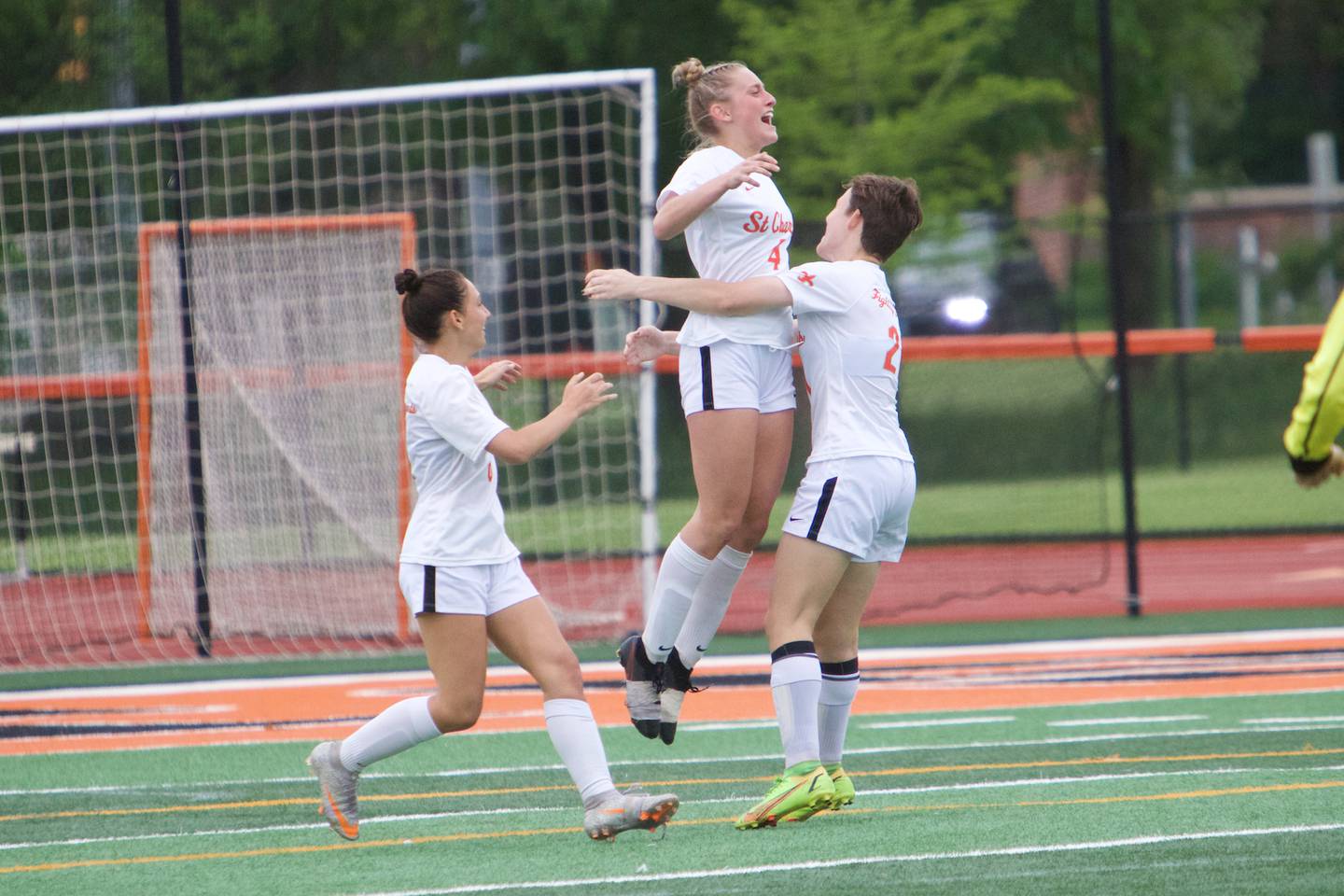 St. Charles East's Grace Williams (4) celebrates scoring a goal against St. Charles North at the Class 3A Sectional Final on May 27, 2022 in St. Charles.