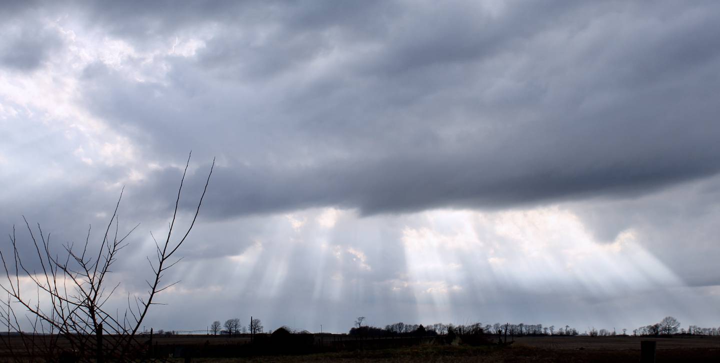 Sun rays pierce storm clouds in the time between the two storm systems that passed through Lee County on Friday, March 31, 2023.