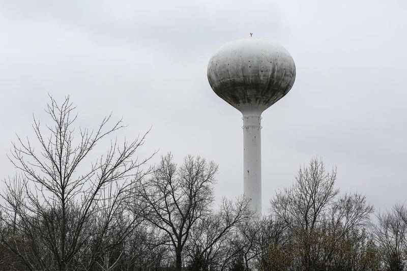 A water tower looms over the Fairmont neighborhood Thursday, Nov. 15, 2018, in Lockport, Ill.