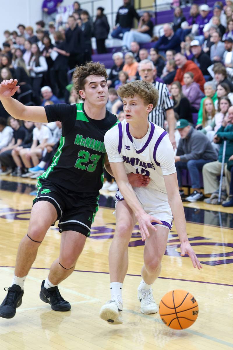 Manteno's Ramsey Owens drives against Bishop McNamara's Karter Krutsinger during the Fightin' Irish's 61-24 victory over Manteno on Tuesday, Jan. 13, 2026.