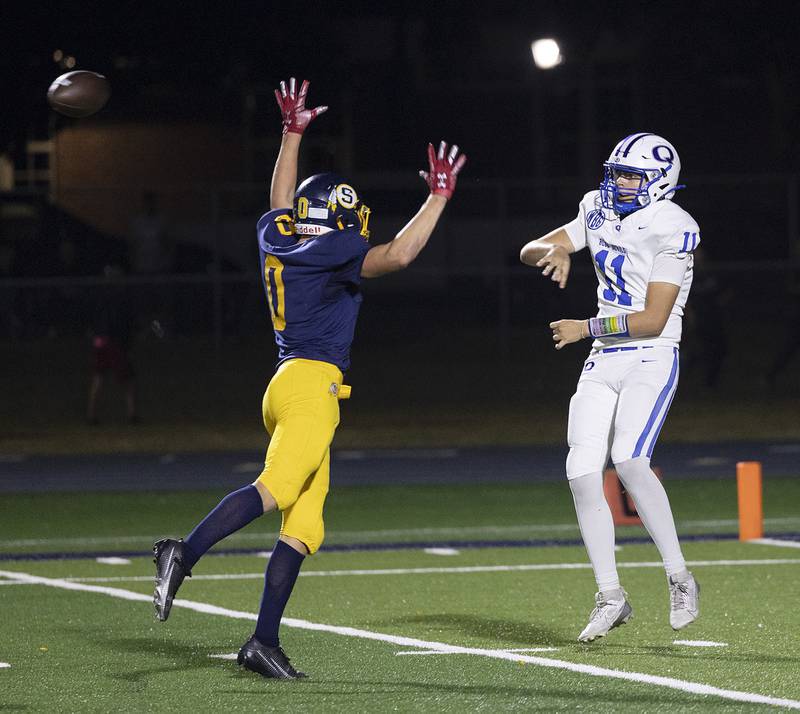 Sterling’s Wyatt Cassens gets in the face of Quincy QB Hunter Schuckman Friday, Oct. 17, 2025.