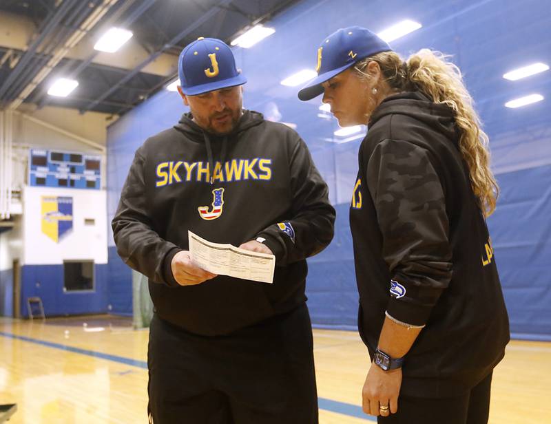 Johnsburg baseball coach Mark Landvick talks with his wife and assistant coach, Sandy, about the indoor baseball practice schedule on Monday, May. 1, 2023, at the school.