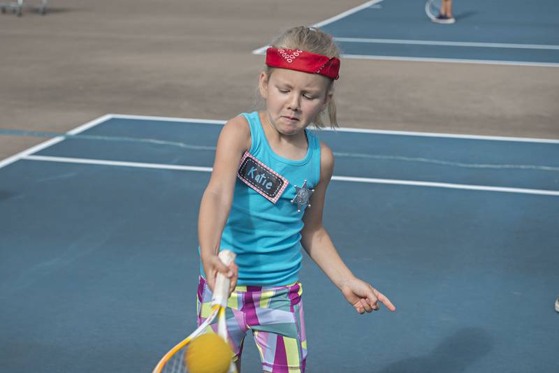 Katie Demmer plays the ball while competing in the tiny tots event at the Emma Hubbs Tennis Classic Monday, July 25, 2022.