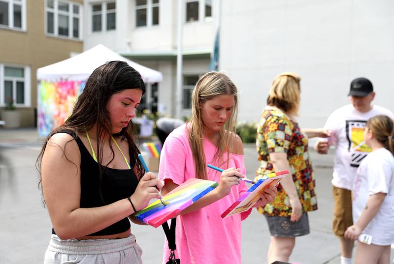 Lali Hernandez (left) of South Elgin and Lauren Dvorak of St. Charles paint rainbows on canvas at the Pinot’s Palette booth during an Inclusion Celebration on Monday, June 2, 2025 in St. Charles. This is the fourth year of the event, which is intended to connect, support, and celebrate members of the community, their families, friends and allies.