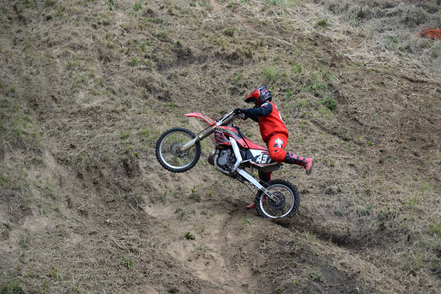 A rider falls short of clearing the hill at the the Rock River Riders Motorcycle Club’s Father’s Day Hillclimb on Sunday, June 16, 2024.