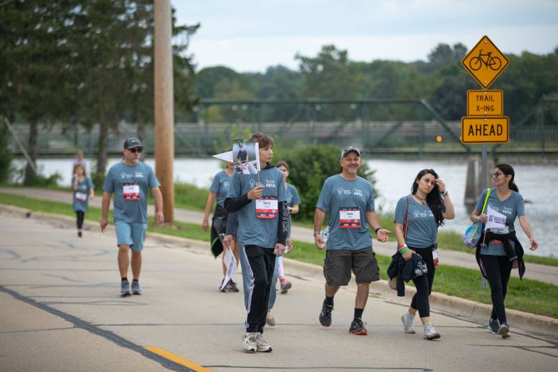 Team American Brain Tumor Association walks along the Fox River in St. Charles during the Fox Valley Marathon on Sunday, Sept. 18, 2022.
