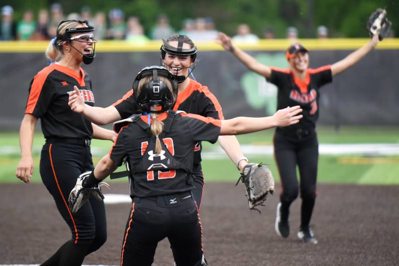 Beecher's Taylor Norkus, center, hugs teammate makenna Albert while Ava Lorenzatti, left, and Elena Kvasnicka also rejoice following the Bobcats' 1-0 win over Seneca in the Class 2A Seneca Sectional championship game Friday, May 30, 2025.