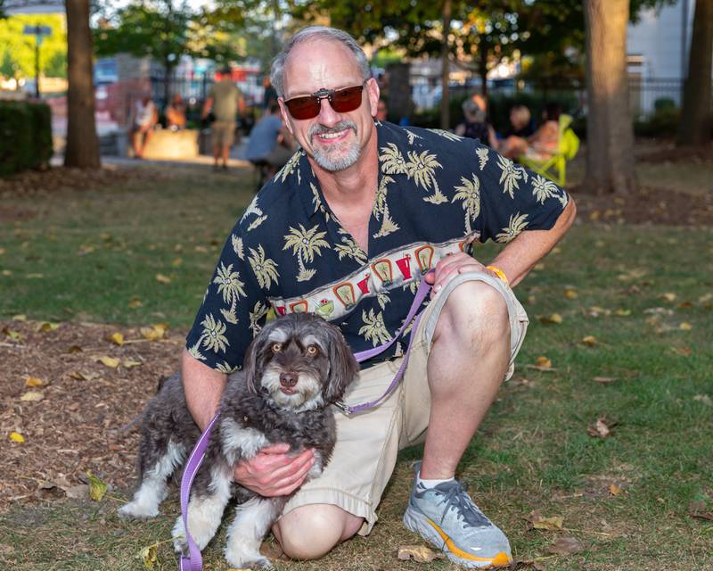 Tim Waynick poses with his dog Murphy at the Brew at the Bridge event. Sept 21, 2024 in Oswego.
