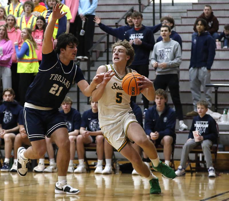 Crystal Lake South's Carson Trivellini drives the baseline against Cary-Grove's Brady Elbert during the IHSA Class 3A Prairie Ridge Regional championship basketball game on Friday, Feb. 28, 2025, at Prairie Ridge High School in Crystal Lake.