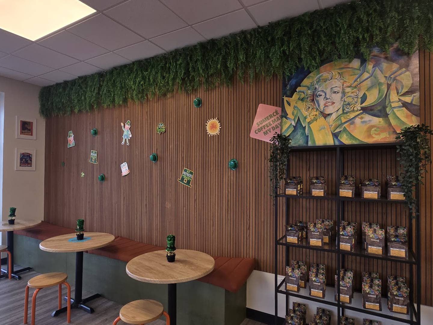 A seating area and bags of Colombian coffee for sale are seen inside Sumercé Colombian Coffee Roasters in Crest Hill on Saturday, March 7, 2026.