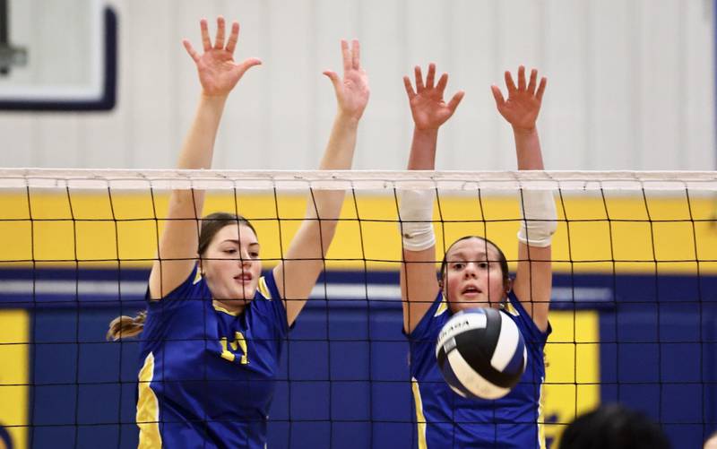 Princeton Logan's Harper Sayler (left) and Sadie Rutledge defend the net in Saturday's  IESA 3A regional match at Pannebaker Gym.