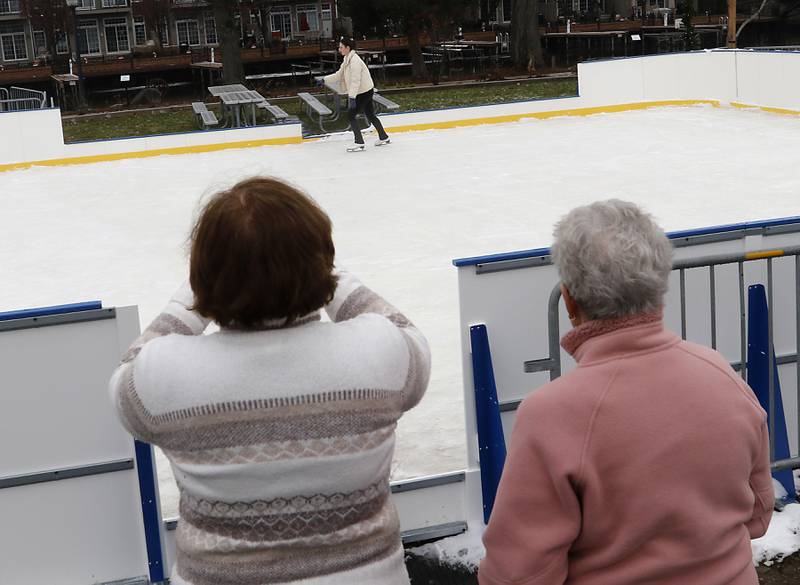 Family members watch as Natasha Lamprecht skates on Dec. 5, 2023, at the Miller Point Park Ice Skating rink in McHenry.
