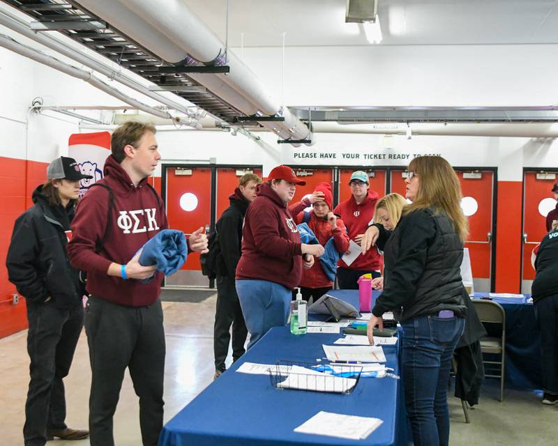 Participants of the polar Plunge get checked in before the plunge on Saturday Feb. 21, 2026, held at Huskie Stadium in DeKalb.