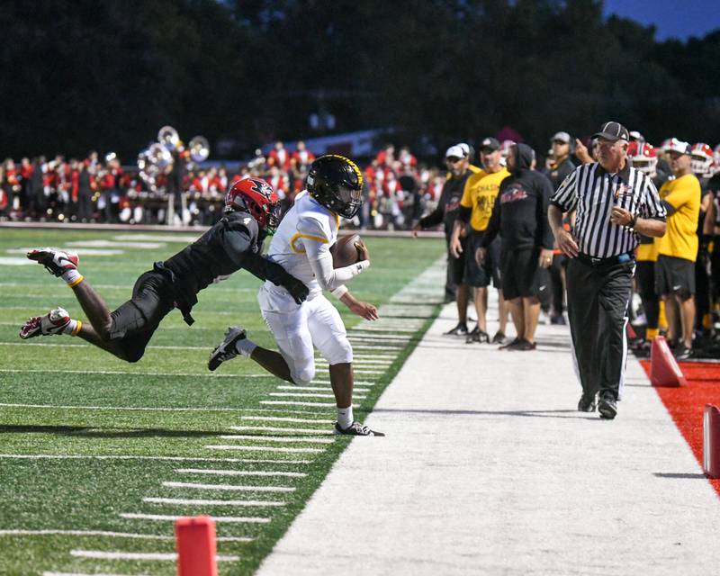 Yorkville's Jayden Ruth, left, pushes Joliet West's Landon Mars (2) out of bounds during the game on Friday Sept. 5, 2025, held at Yorkville High School.