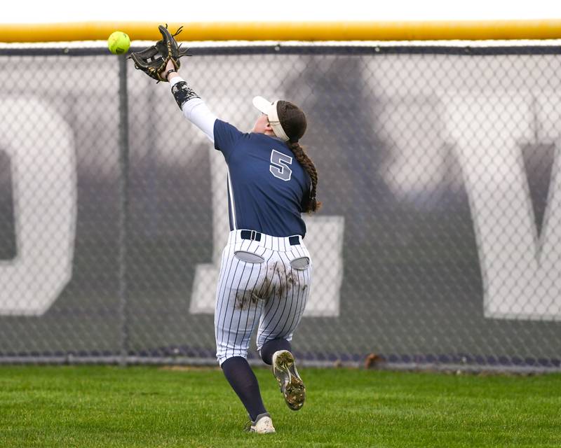 Oswego East’s Katie Silva (5) reaches for the ball but comes up short during the game on Thursday April 17, 2025, while taking on Plainfield North held at Oswego East High School.