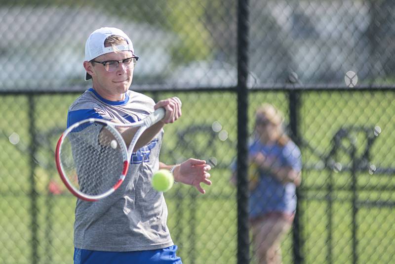 Newman’s Koda Brininger plays a shot against Sterling Monday, May 9, 2022. Bonnell and doubles partner Tyler Bonnell faced off against Sterling’s Connor Pham and Luke Valentino.