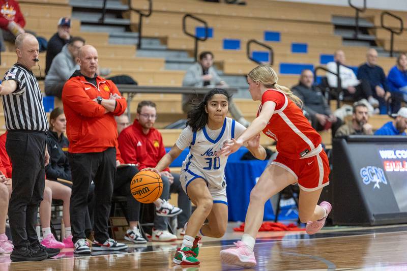 St. Charles North' Lelanie Posada looks to drive to the basket against Batavia's Harper Haren on Friday, Dec.12,2025 in st. Charles.